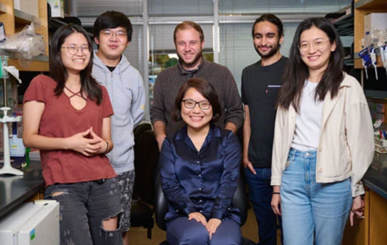 Scientists posing in their lab.