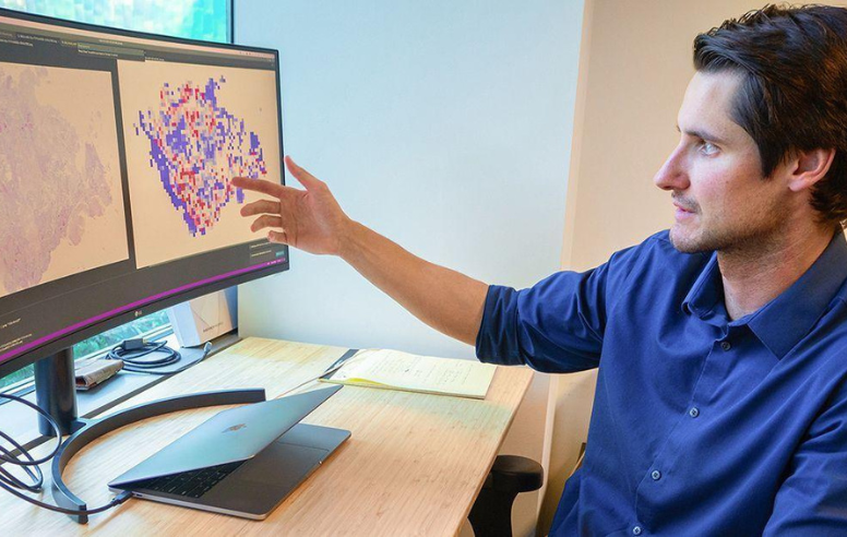 Dr. Bergstrom looking at biopsies. 